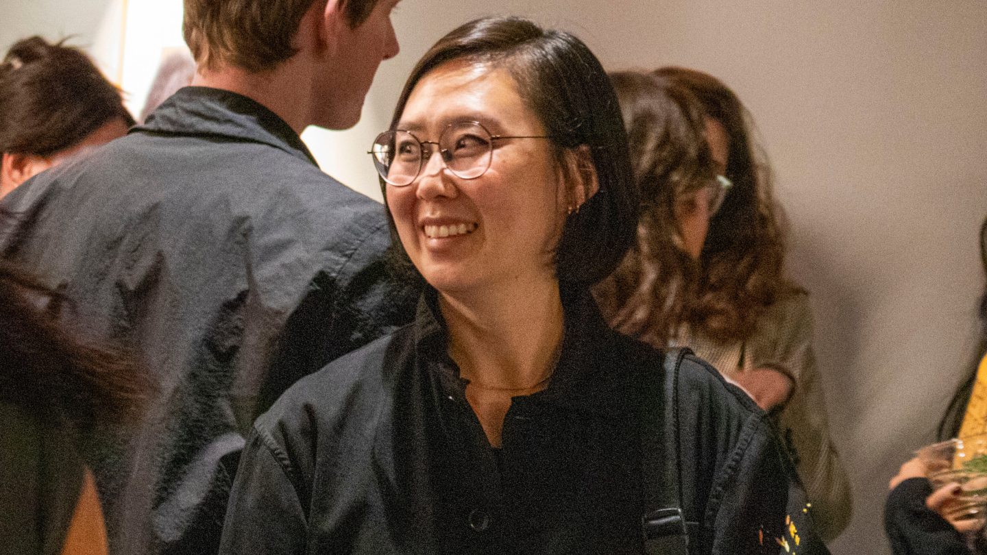 A photograph of Minju Bae. She faces her right and smiles.